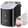 The image features a black and white appliance, likely a blender or ice maker, with a glass of pink liquid, possibly a cocktail or a smoothie, sitting next to it. The appliance is filled with ice, and the glass is filled with ice as well. The appliance is made by Costway, and it is designed to make ice and blend drinks. The image showcases the convenience and efficiency of this appliance, making it an ideal addition to any home or office.