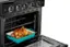 The oven has a digital display with the following text: "3 Off - MAE DFF - a ... - - - DAF 1 - . - D - a 0 MAS - nd a - - ." This text likely indicates the oven's settings and functions, such as the temperature, cooking mode, and timer.