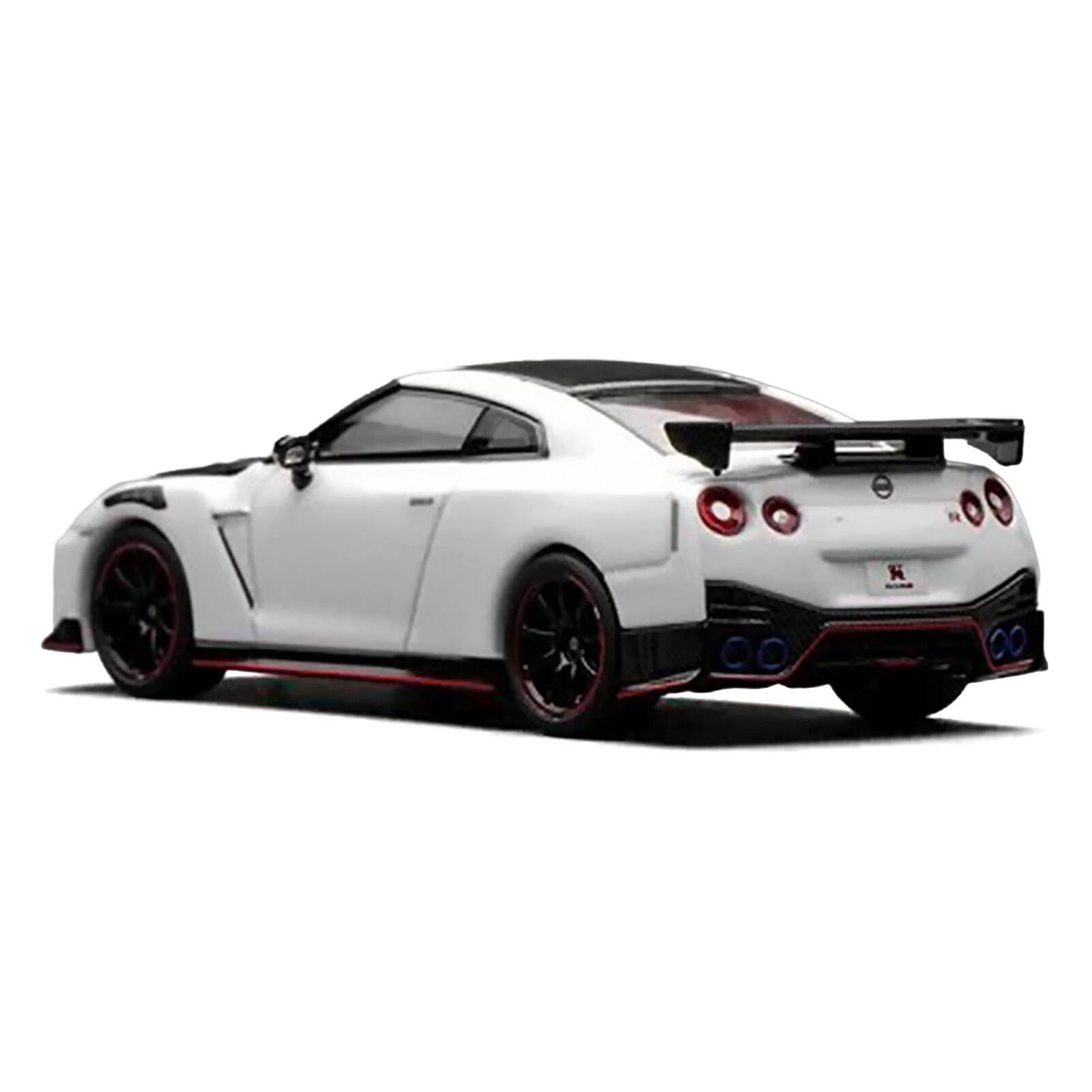 Alt View 3. MotorHelix - 2022 Nissan GT-R Nismo R35 RHD Brilliant White Pearl with Carbon Hood and Top "Senior 64" 1/64 Car by MotorHelix.