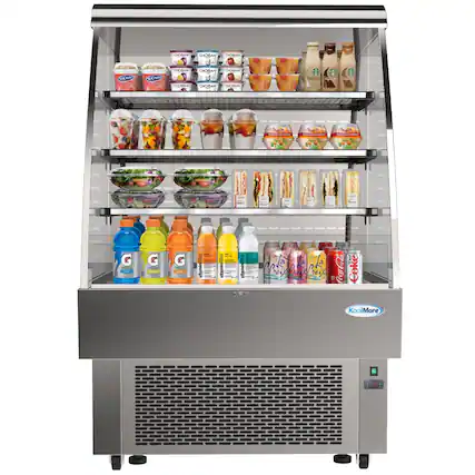 The image features a refrigerator filled with various drinks and food items. There are multiple bottles of juice, including Gatorade, and other beverages such as Coca-Cola and Kool-Aid. The refrigerator also contains sandwiches and other food items, making it a convenient place to store and access a variety of refreshments and snacks.