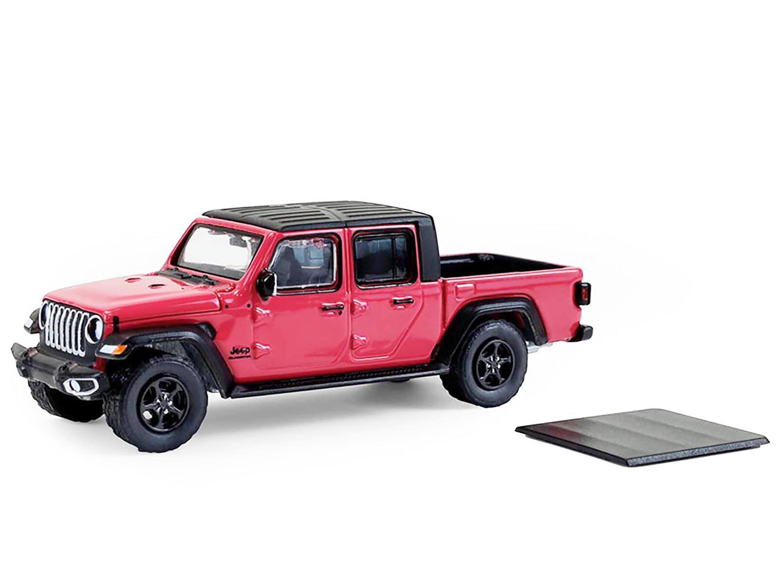 Angle. Greenlight - 2024 Jeep Gladiator Pickup Truck Tuscadero Pink with Black Top "Showroom Floor" Series 7 1/64 - Pink with Black Top.