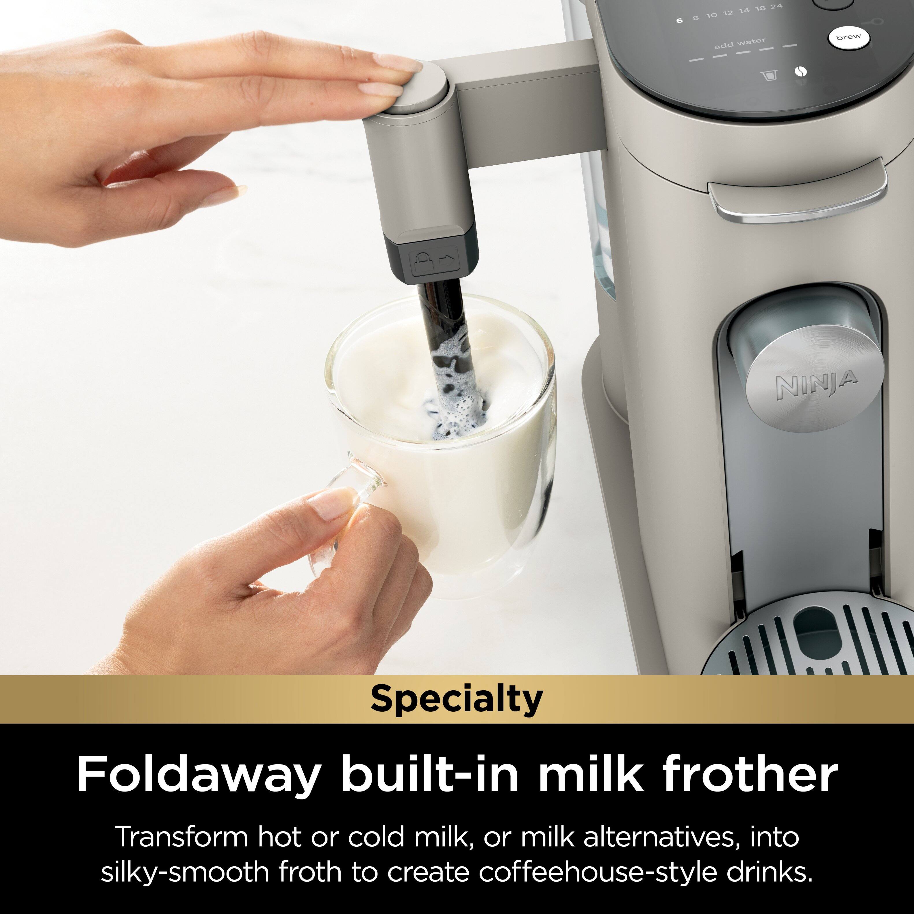 The text on the image reads: "Foldaway built-in milk frother. Transform hot or cold milk, or milk alternatives, into silky-smooth froth to create coffeehouse-style drinks."