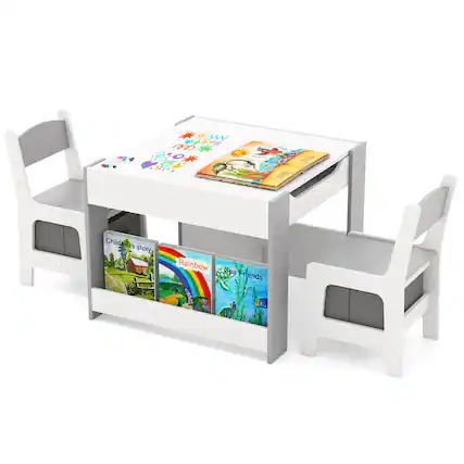 The image features a white table with two white chairs, each with a bookshelf underneath. The table has a variety of books on it, including children's storybooks. The books are arranged in a way that they are easily accessible to the children sitting at the table. The table is designed to encourage reading and learning in a comfortable and inviting setting.