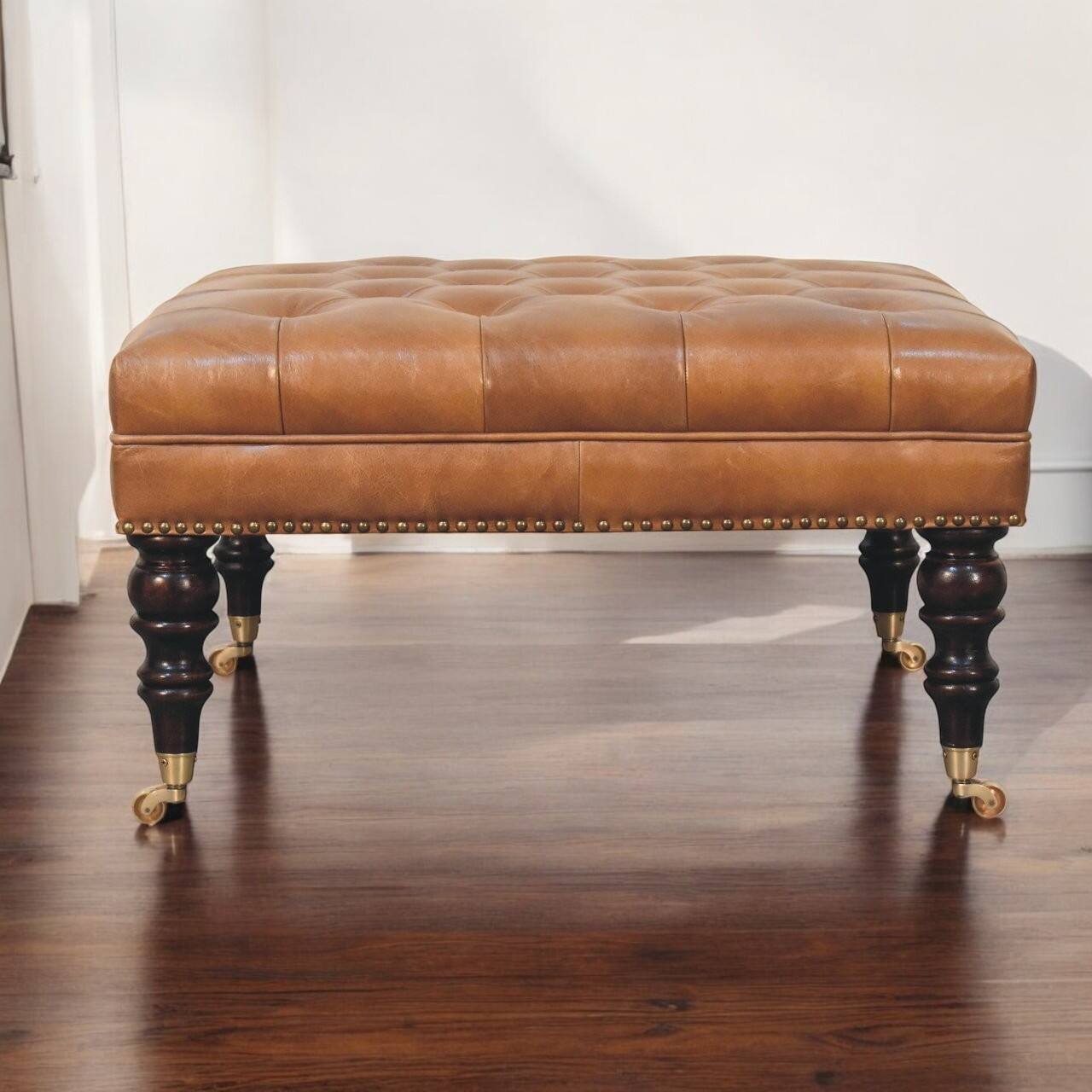 Angle. Artisan Furniture - Artisan Furniture Solid Wood Studded Buffalo Tan Leather Ottoman with Castor Legs, Upholstered, Brown - Brown.