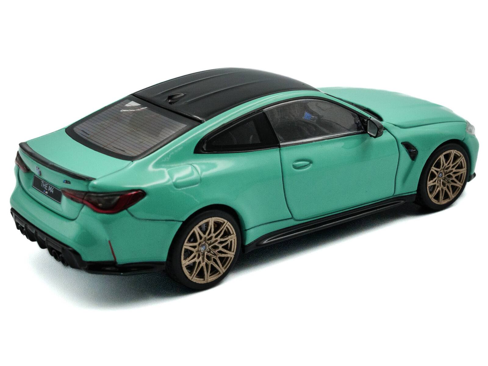 Left. Solido - 2023 BMW M4 Competition (G82) Mint Green with Black Top 1/43 Diecast Model Car by Solido - Mint Green with Black.