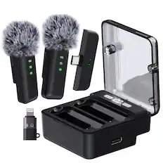 A3 B 114 8 1N4 FoC LOL Fo0g
The image shows a portable, foldable phone stand with a built-in wireless charger. It has two furry microphone covers, a USB-C cable, and a charging pad.