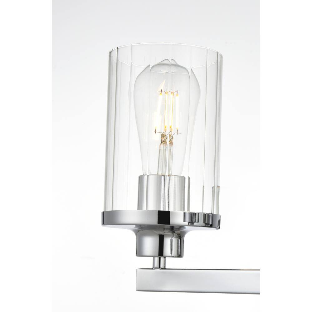 Left. Living District - Saanvi 3 light Chrome and Clear Bath Sconce - Chrome And Clear.