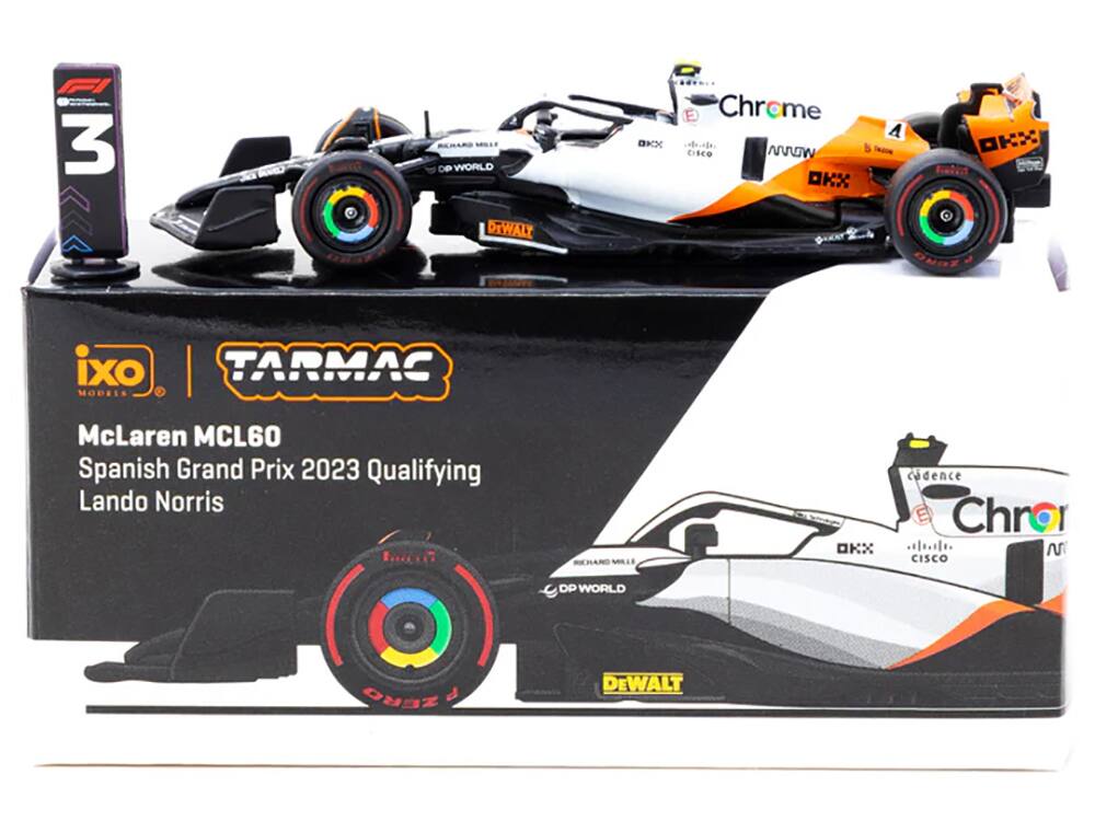 Sure, here is the corrected and grouped text from the image:

---

**McLaren MCL60**  
Spanish Grand Prix 2023 Qualifying  
Lando Norris  

**Sponsors:**  
- Richard Mille  
- DP World  
- Cisco  
- Dewalt  
- Chroma  
- Tarmac  
- ixo Models  

**Box Text:**  
- ixo Models  
- Tarmac  
- Chroma  
- DP World  
- Dewalt  
- Cisco  
- cadence  

**Car Details:**  
- 3  
- A  
- OKX  
- Chroma  
- Cisco  
- cadence  
- Richard Mille  
- DP World  
- Dewalt  

---