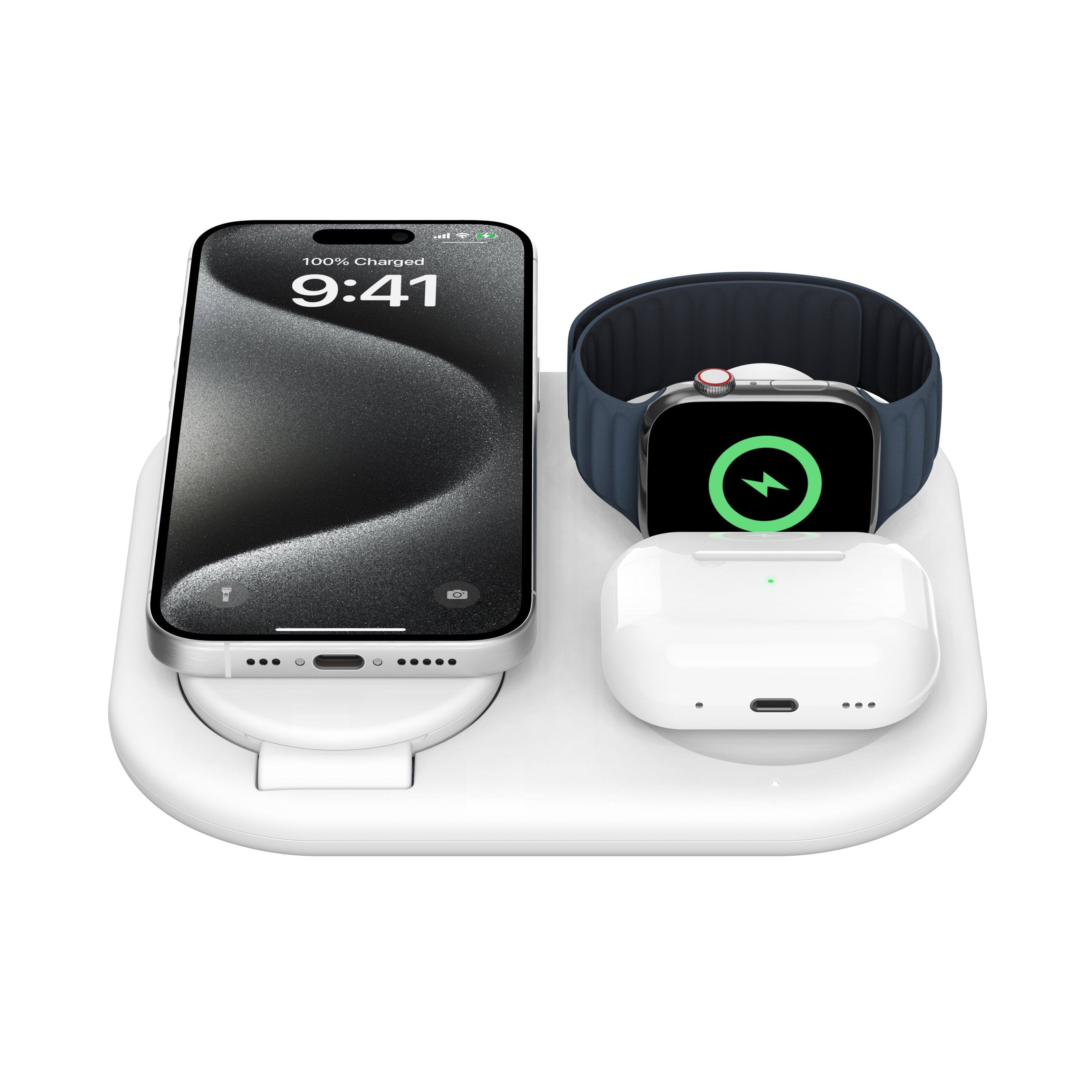 The image shows a cell phone and a watch sitting on a table. The cell phone is fully charged, as indicated by the 100% charge displayed on the screen. The time on the cell phone is 9:41.