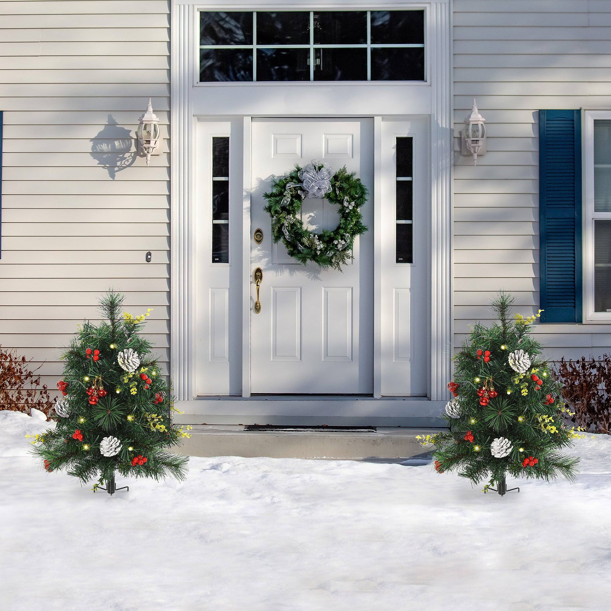 Angle. BreeBe - 22.5in Christmas Tree 2-Pack Outdoor Pre-Lit Artificial Pine Cordless with 24 Warm White Lights and Stakes - Green.