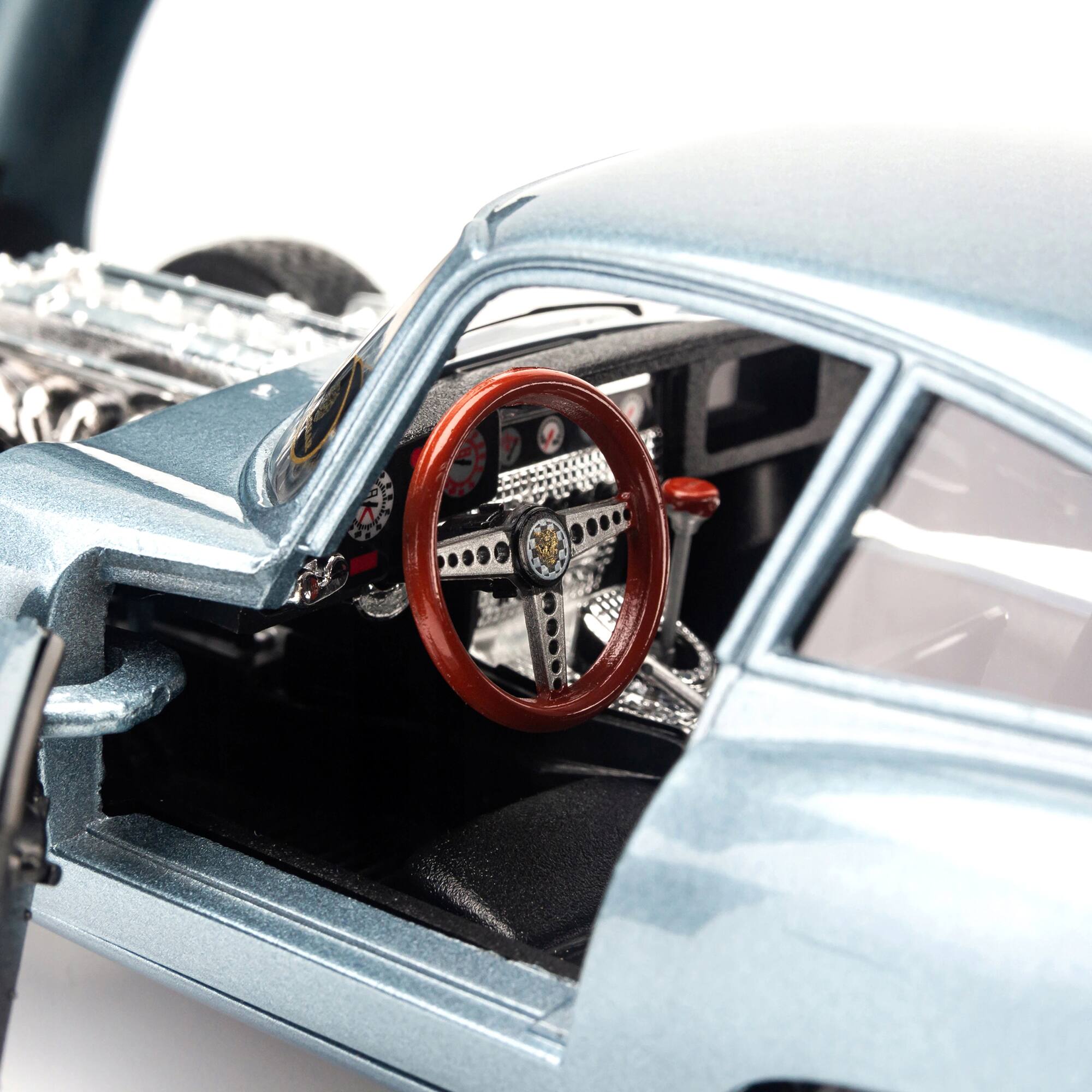 Left. Bburago - 1961 Jaguar E Type Coupe Blue Metallic 1/18 Diecast Model Car by Bburago - Metallic Blue.