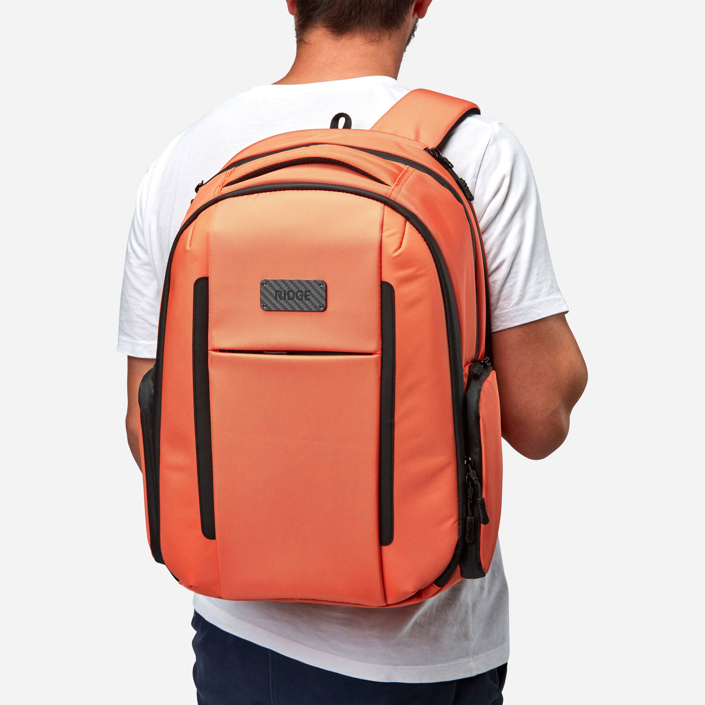 Angle. The Ridge Wallet - Commuter Backpack Basecamp Orange - Orange.