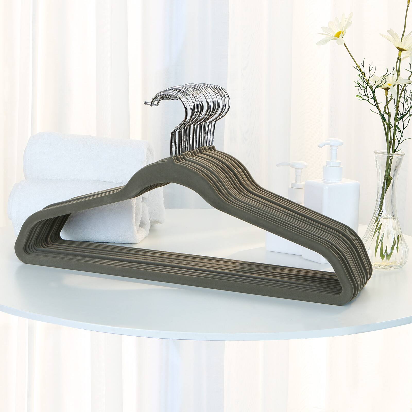 Left. Songmics Home - Clothes Hangers, Pack of 50 Plastic Coat Hangers, Space-Saving, 0.2 Inches Thick, 17.7 Inches Wide, 360° Swivel Hook - Light Gray and Dark Gray.