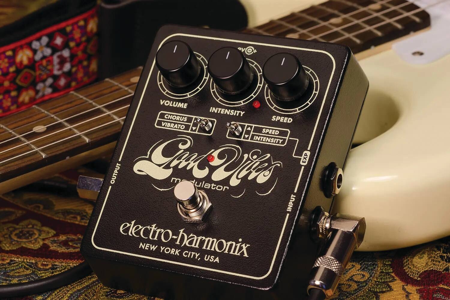 Sure, here is the corrected and grouped text from the image:

**Top Section:**
- **VOLUME**
- **INTENSITY**
- **SPEED**

**Middle Section:**
- **CHORUS VIBRATO**
- **SPEED**
- **INTENSITY**

**Bottom Section:**
- **electro-harmonix**
- **NEW YORK CITY, USA**

**Additional Text:**
- **INPUT**
- **OUTPUT**
- **EXP**