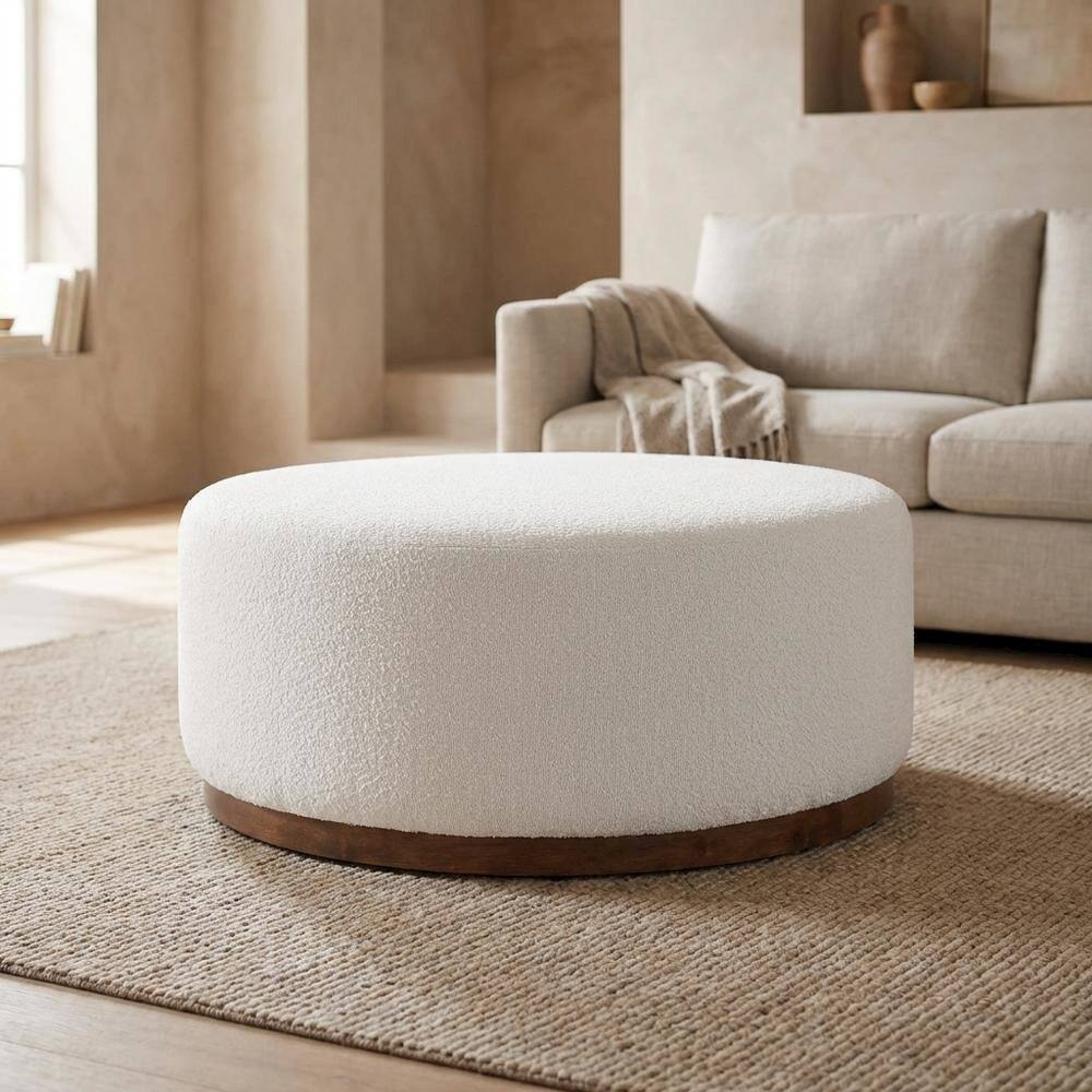 Left. Outdoor Escape - Round boucle upholstered outdoor ottoman with cushioned top, modern design - Brown.