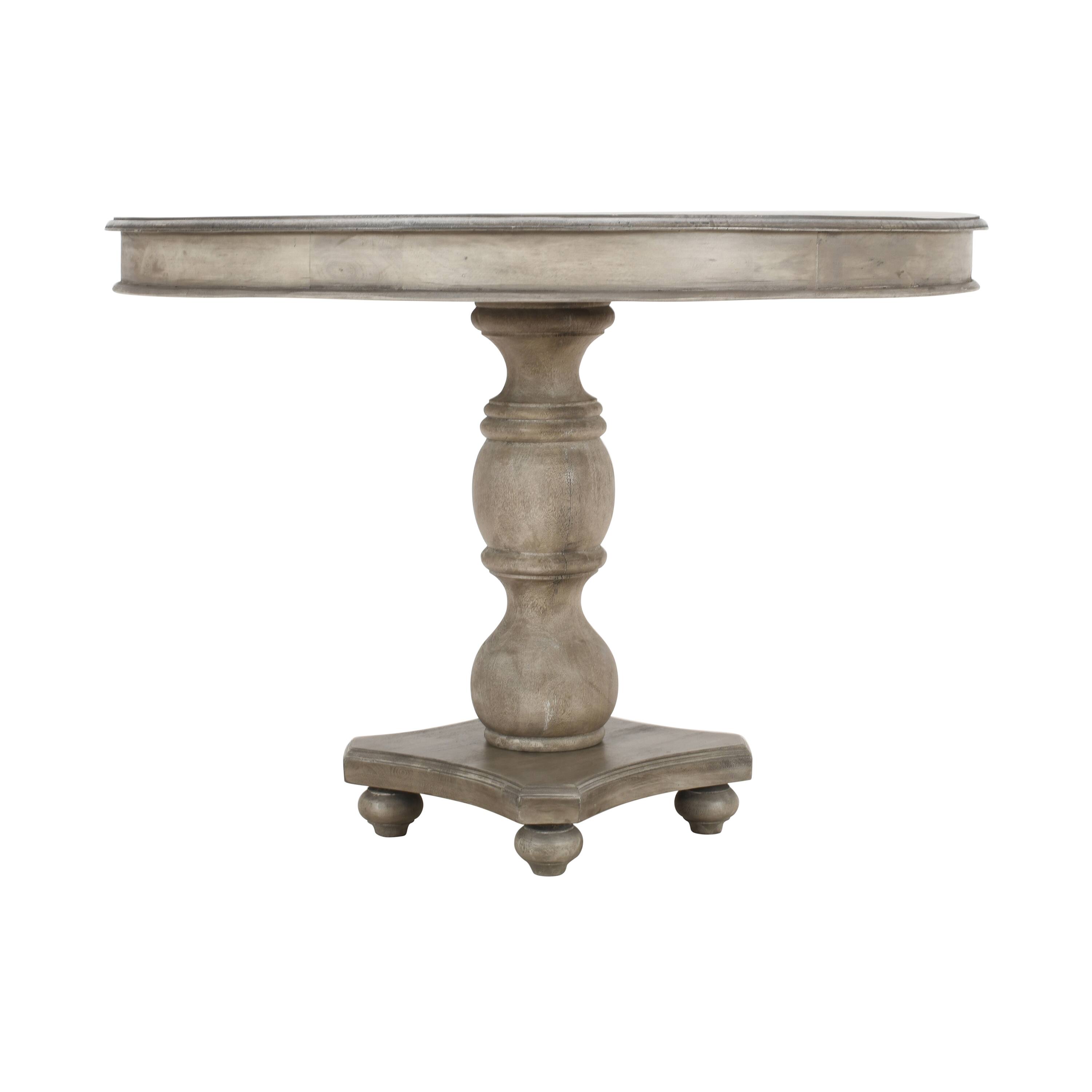 Left. Manhattan Lane - 42 Inch Handcrafted Mango Wood Dining Table, Pedestal Base, Round Molded Top - Washed White and Gray.