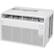 The image features a white LG air conditioner with a fan speed control. It is a portable air conditioner with a ventilation system, designed to provide efficient cooling for various settings. The air conditioner is placed on a white surface, which could be a countertop or a table.