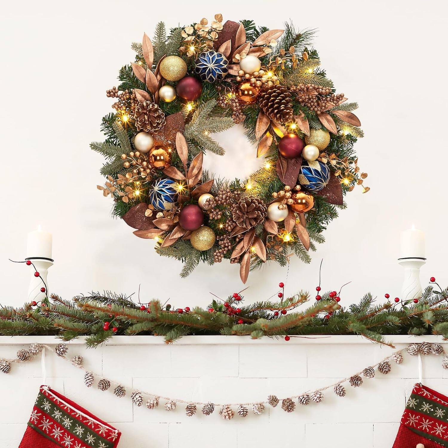 The image does not contain any text. It shows a festive Christmas decoration with a wreath, garland, and stockings.