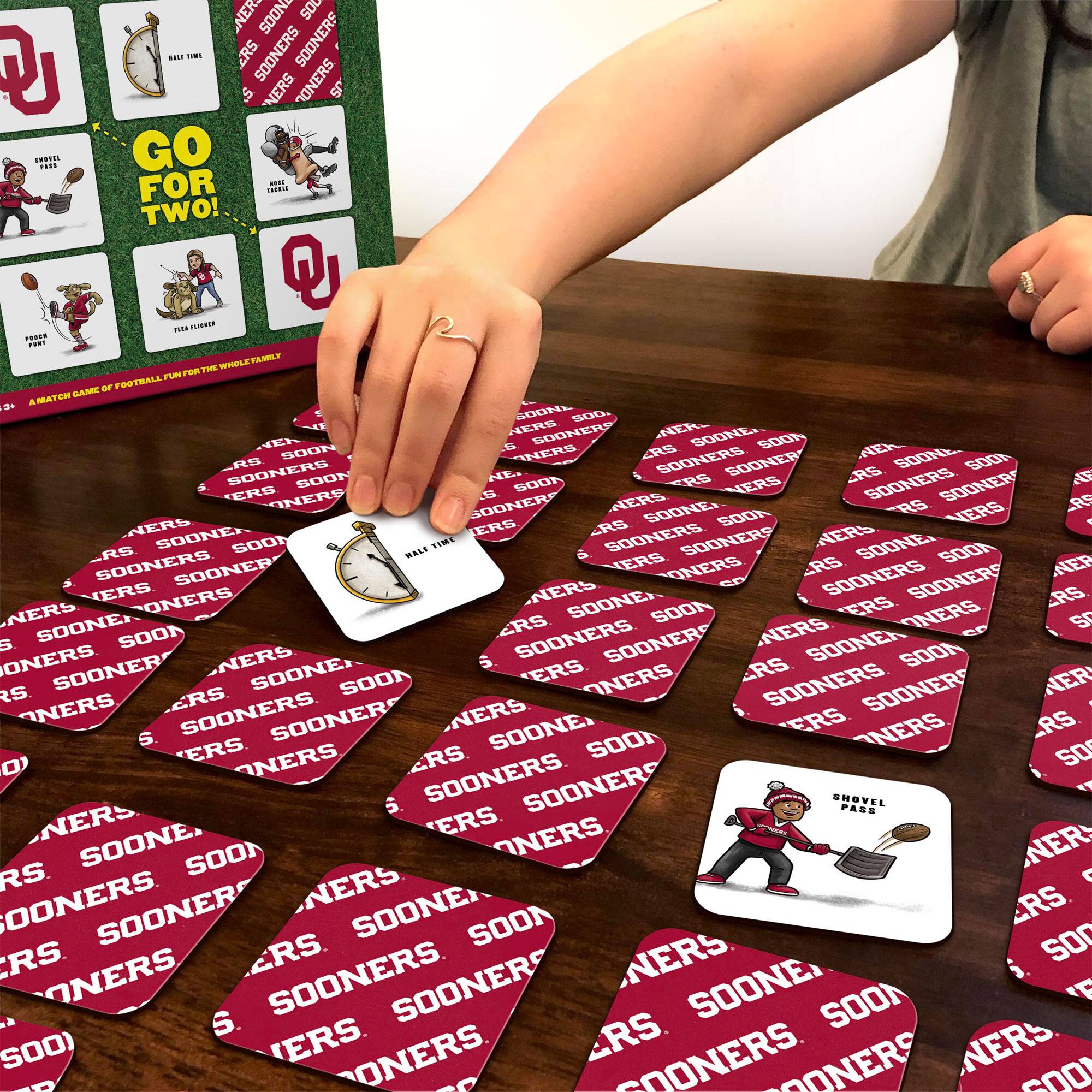 Sure, here is the corrected and grouped text from the image:

**Box:**
- GO FOR TWO!
- A MATCH GAME OF FOOTBALL FOR THE WHOLE FAMILY
- HALF TIME
- TRAVEL FOR A TOUCHDOWN
- POUR A POINT
- TIELE FUMBLE
- SHOVEL PASS

**Cards:**
- SOONERS
- NERS
- SOON
- SOONER
- SOONERS
- NERS
- SOON
- SOONER
- SOONERS
- NERS
- SOON
- SOONER
- SOONERS
- NERS
- SOON
- SOONER
- SOONERS
- NERS
- SOON
- SOONER
- SOONERS
- NERS
- SOON
- SOONER
- SOONERS
- NERS
- SOON
- SOONER
- SOONERS
- NERS
- SOON
- SOONER
- SOONERS
- NERS
- SOON
- SOONER
- SOONERS
- NERS
- SOON
- SOONER
- SOONERS