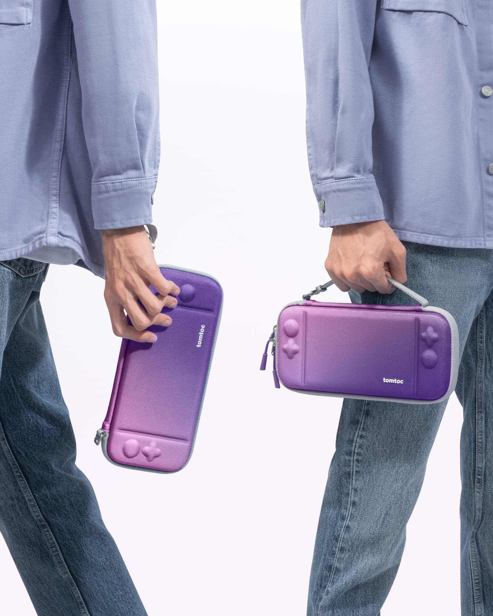 The image shows a person holding two purple and white cell phones.