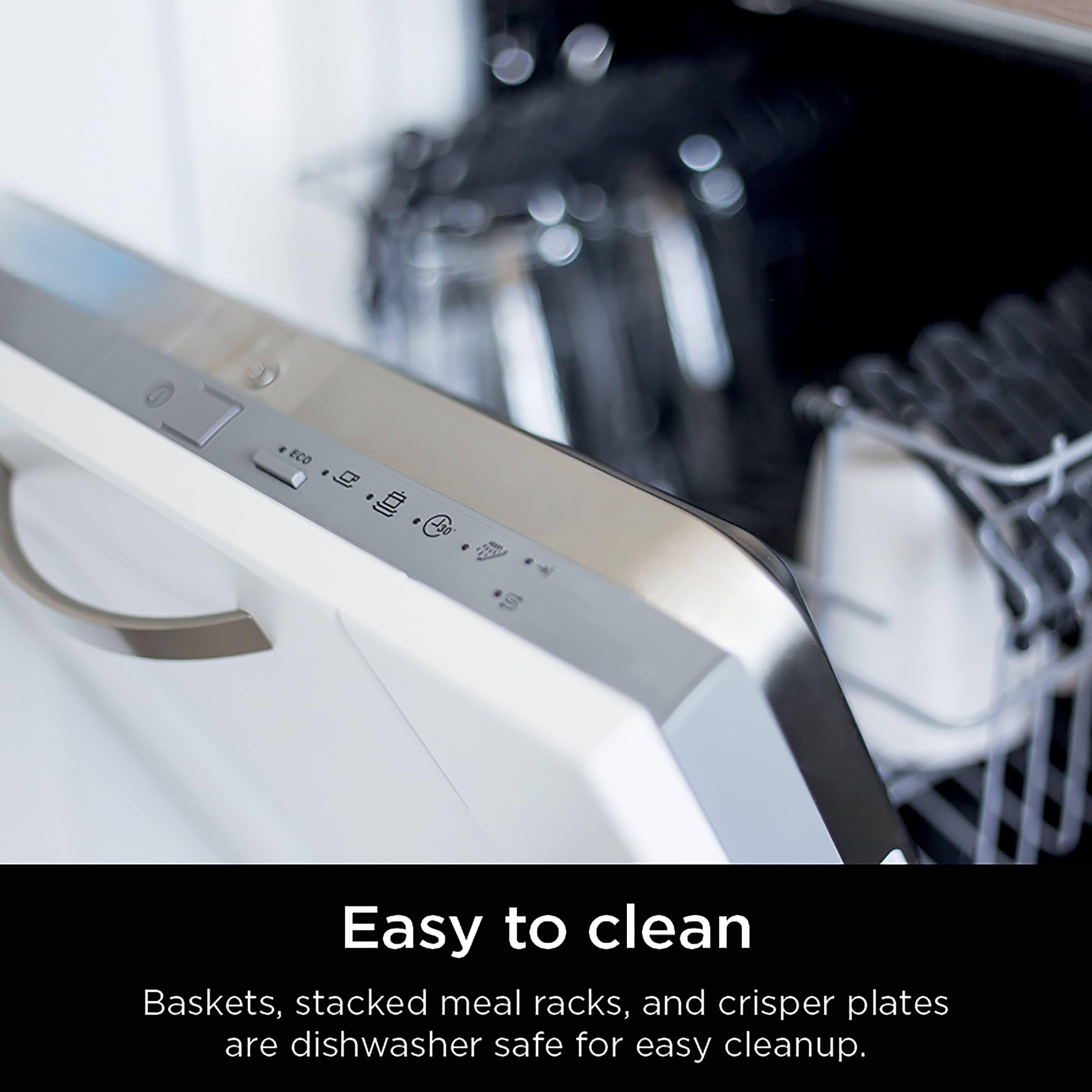 The image features a kitchen appliance with a dishwasher safe design. The appliance is made of stainless steel and has a modern appearance. The text on the image reads, "Easy to clean Baskets, stacked meal racks, and crisper plates are dishwasher safe for easy cleanup." This indicates that the appliance is designed to be convenient and efficient for cleaning purposes, making it a practical choice for users.