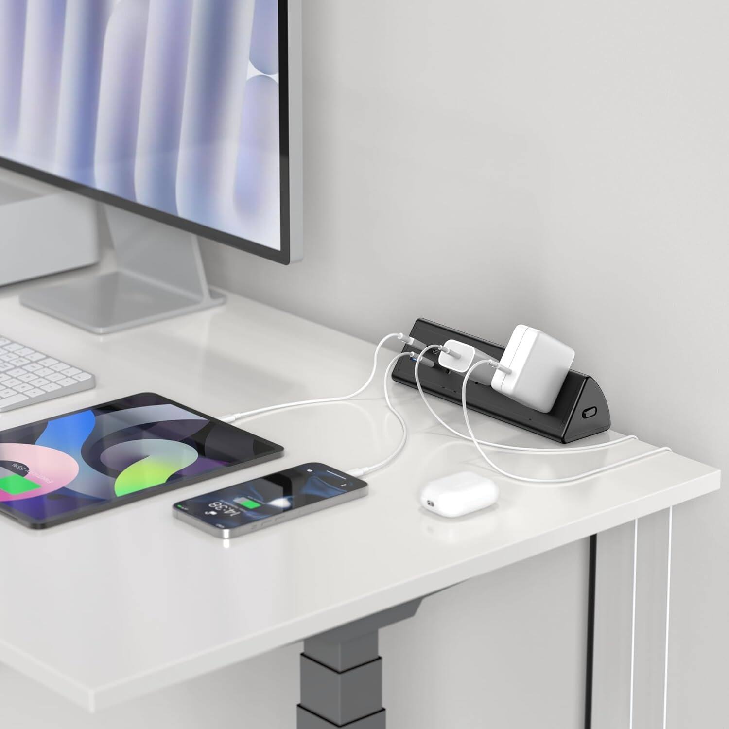 Angle. PARKER SLATER - Desk clamp power strip with surge protection, 20W fast charging, 2 USB-C, 2 USB-A, and multiple AC outlets. - Black.