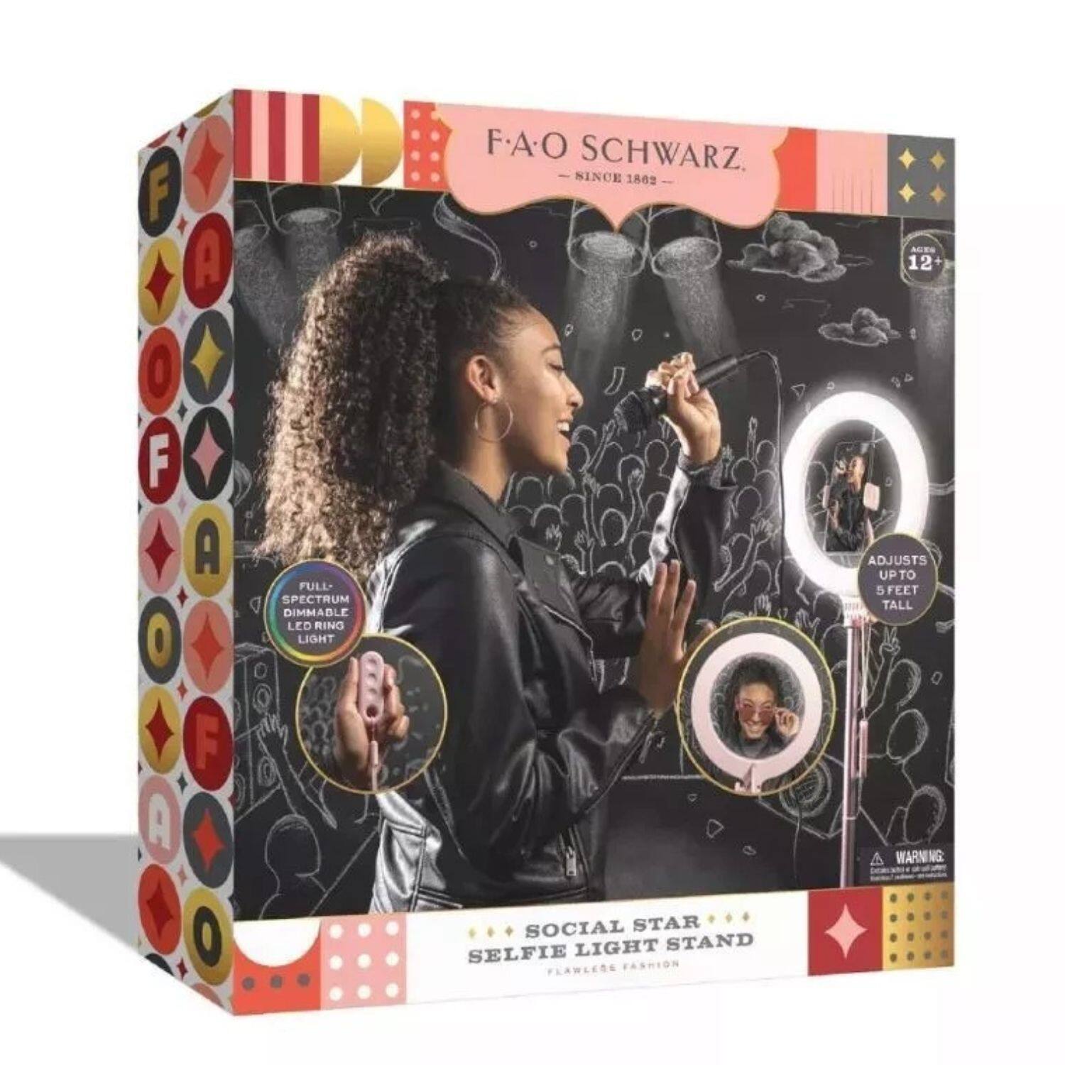 F.A.O. Schwarz  
Since 1862  

FULL SPECTRUM DIMMABLE LED RING LIGHT  

SOCIAL STAR  
SELFIE LIGHT STAND  
FLAWLESS FASHION  

ADJUSTS UPTO 5 FEET TALL  

WARNING