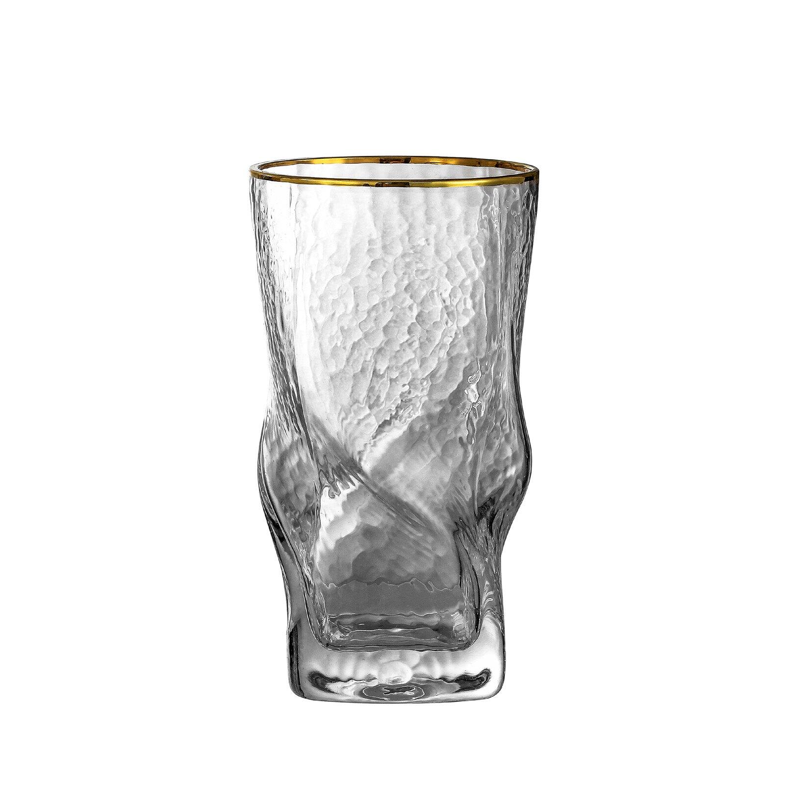 Front. BreeBe - Gold Rimmed Hammer Twist Whiskey Glass (set of 4) - 3.14"W x 5.31" H - Clear with gold rim.