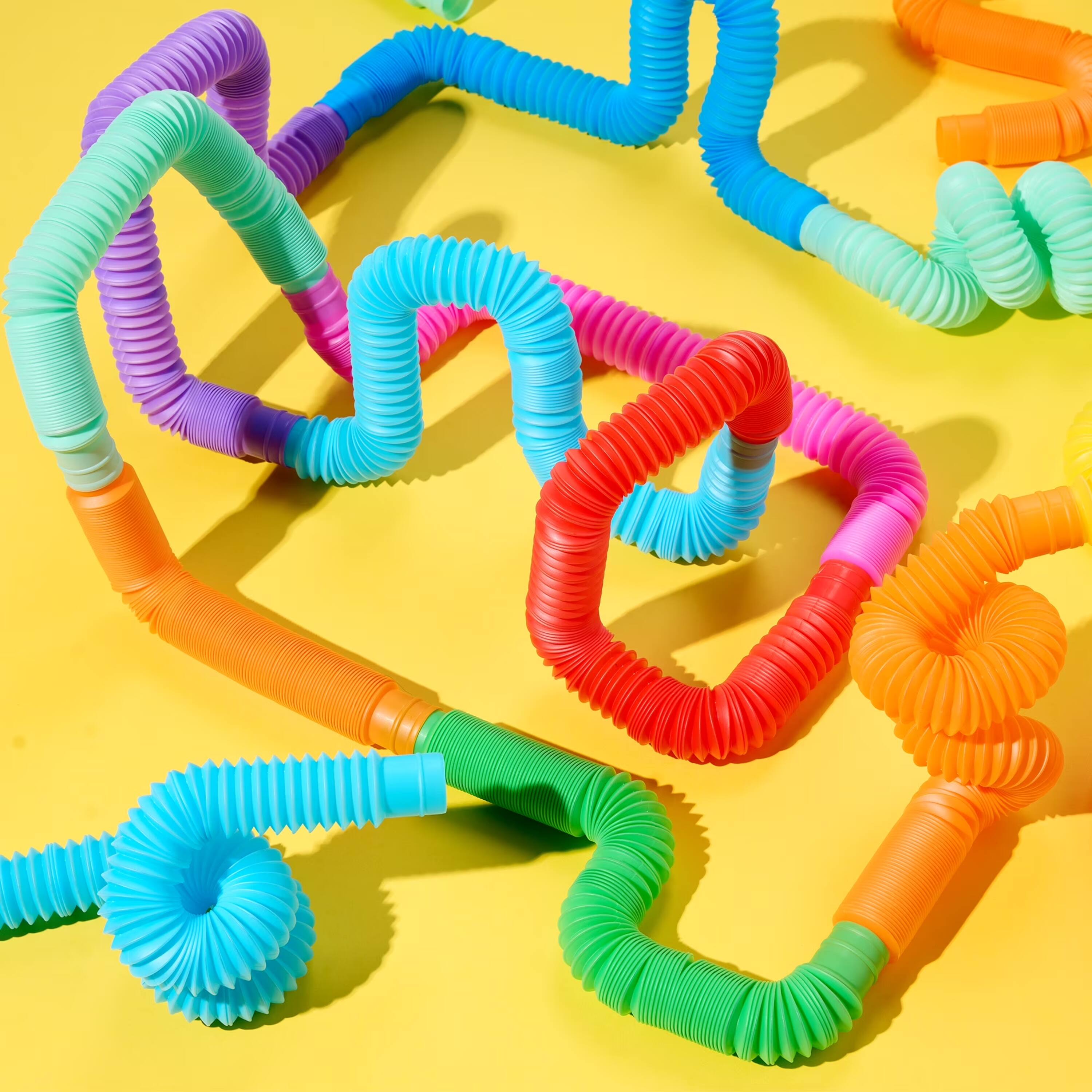 Left. Joyfy - 9 Pack Large Pop Tubes Sensory Toys Up to 27.5" Fidget Tubes Party Favors for Kids Connectable & Extendable Stress - Multicolor.