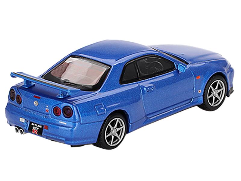 Left. Mini GT - Nissan Skyline GT-R (R34) V-Spec RHD (Right Hand Drive) Bayside Blue Metallic Limited Edition 1/64 - Blue Metallic.