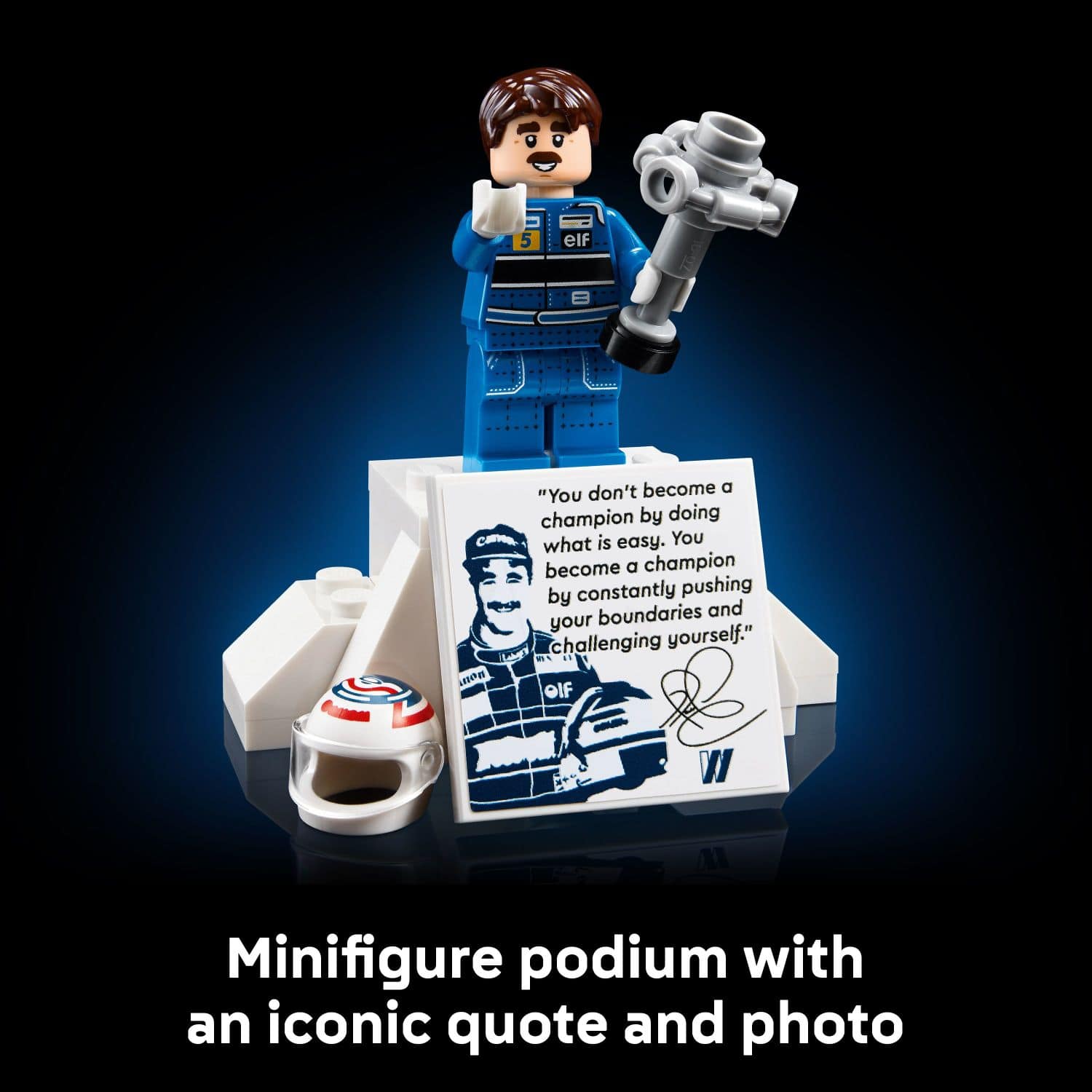 Minifigure podium with an iconic quote and photo: "You don't become a champion by doing what is easy. You become a champion by constantly pushing boundaries and challenging yourself."