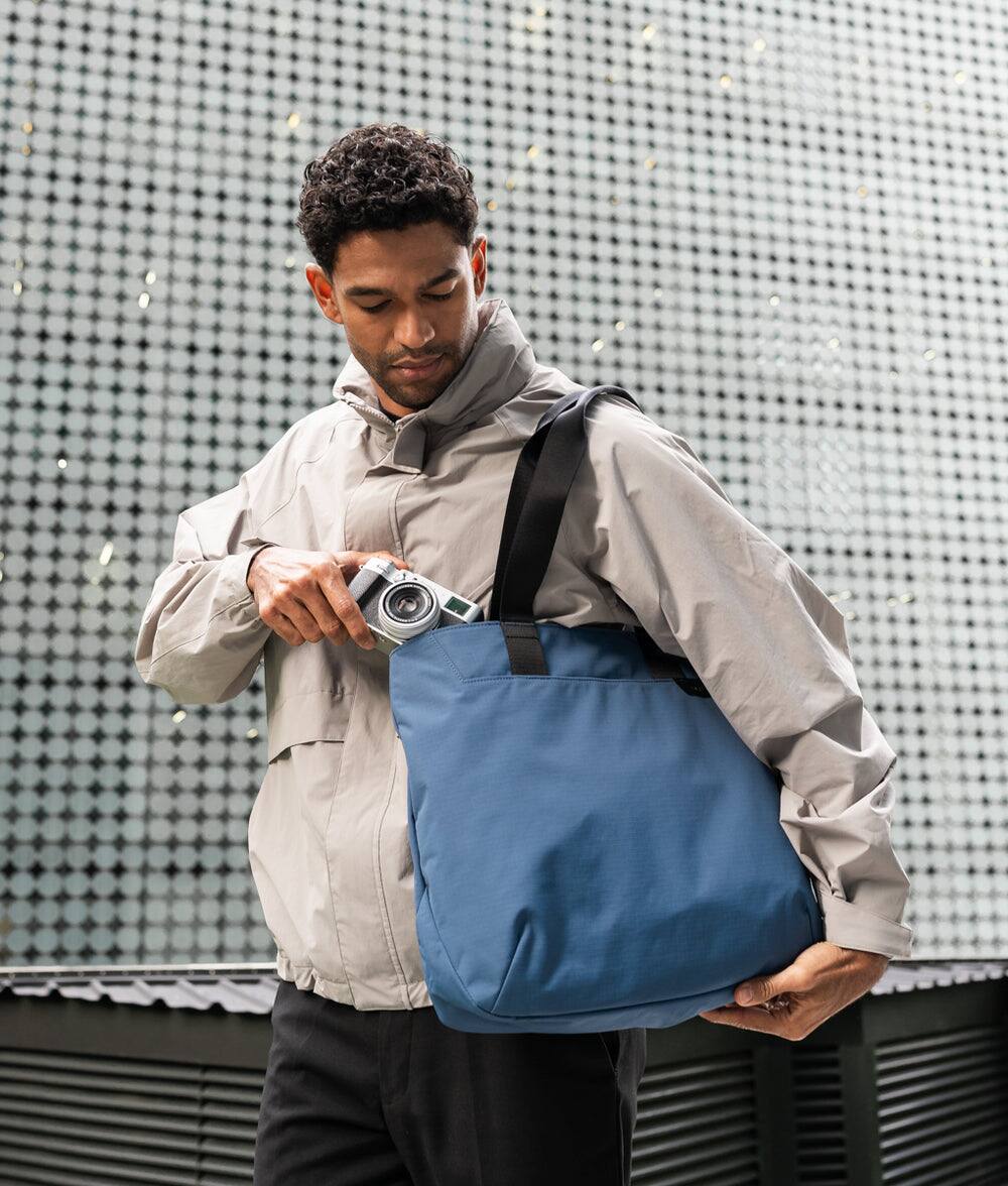 Back. ALPAKA - Elements Tote Bag 14.5L Weatherproof Foldable Travel Tote with Magnetic Closure - Blue/G Axoflux 210D.