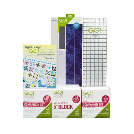 Sure, here is the corrected and grouped text from the image:
---
**GO! QUBE**
- **Quilt in a Day**
- Mix and Match Blocks and Quilts
- 4.5", 6.5", 8.5", 10" and 12" Blocks Using AccuQuilt GO! Cutter
- Includes 10 FREE Corners
- 4 Dies
- Companion Set
- **Companion Set**
- Mix & Match 5" Block
- 4 Dies
- 10 FREE Corners
- **Companion Set**
- Mix & Match 5" Block
- 4 Dies
- 10 FREE Angles
- **Strip Cutter**
- Angled Guides
- Outside Ruler
- 14 FREE Angles
- **Ruler**
- GO! Ruler
- Angled Guides
- Outside Ruler
---
This text is grouped by product and includes all the relevant details from the image.