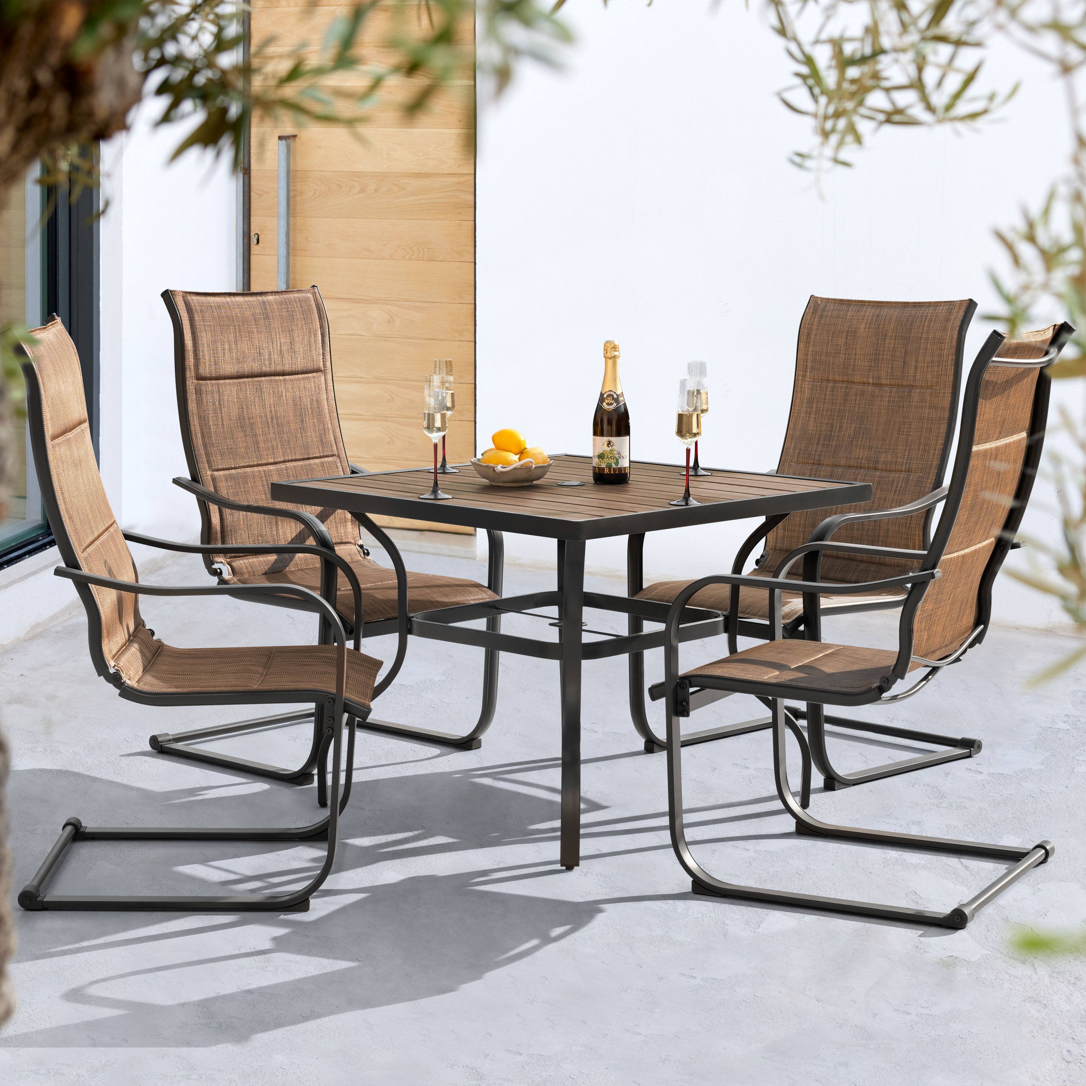 Angle. Nuu Garden - 5PCS Patio Dining Set with Faux Wood Top, Padded Textilene C-Spring Chairs - Brown and Black.
