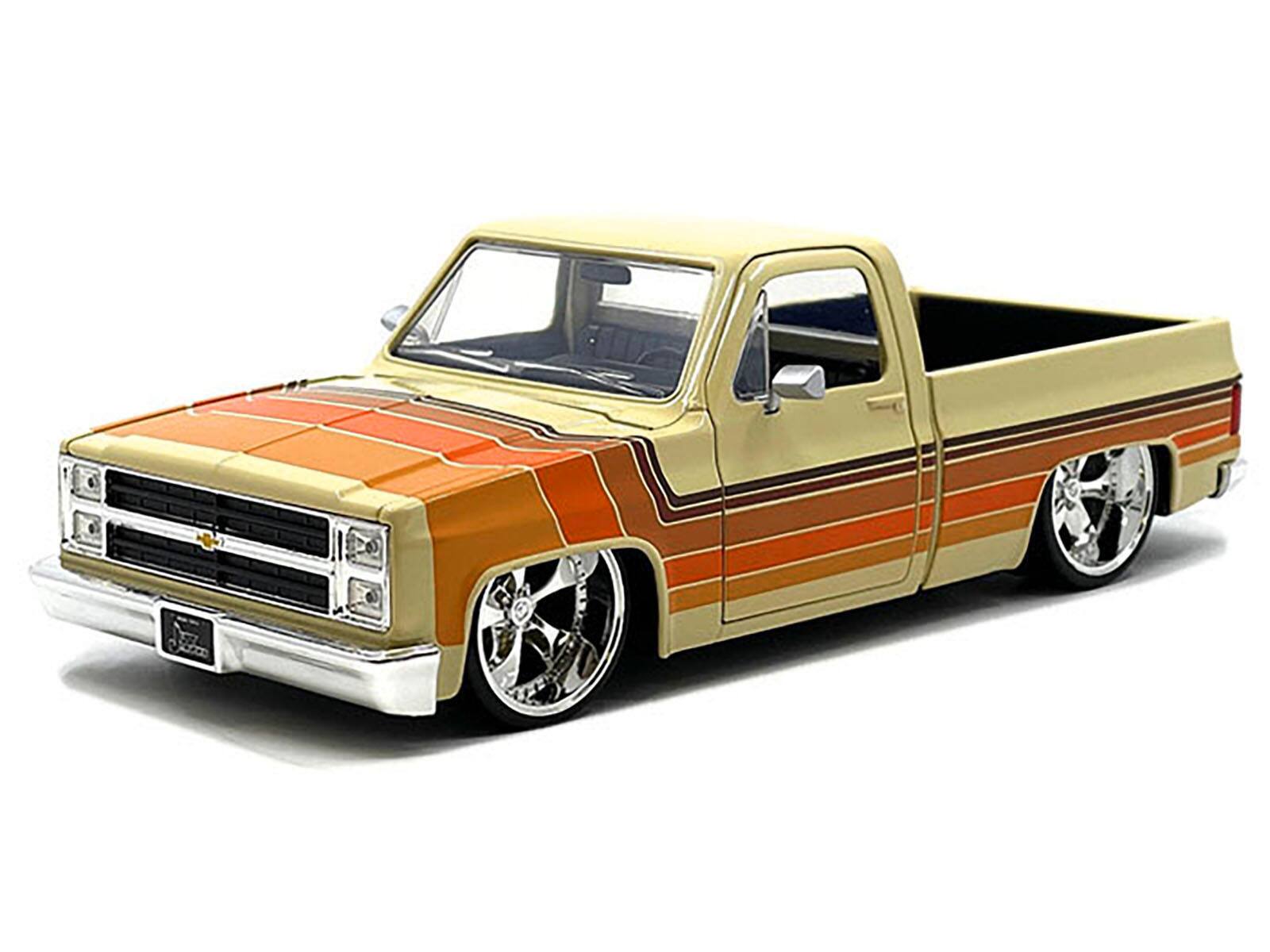 Angle. Jada - 1985 Chevrolet C-10 Pickup Truck Beige with Stripes and Cartelli Wheels "Just Trucks" Series 1/24 - Beige .