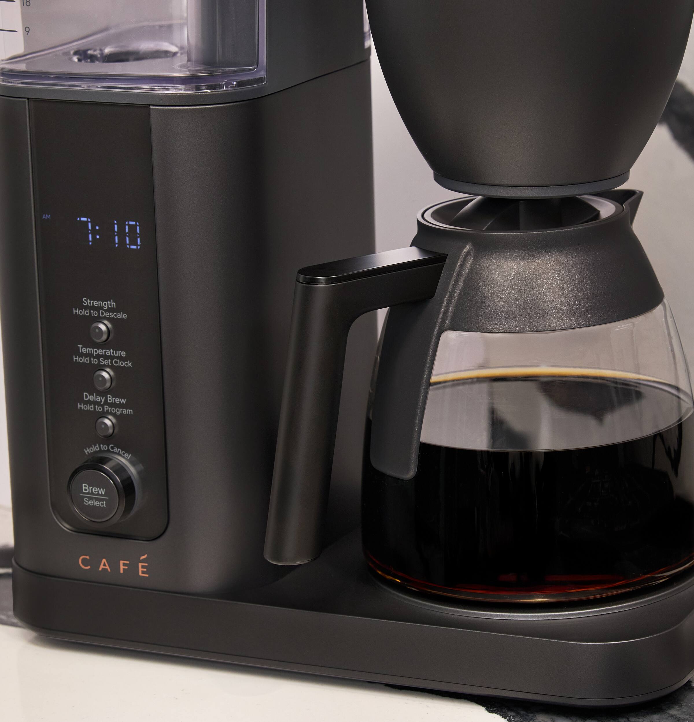 18  
9  
AM 7:10  
Strength Hold to Descale  
Temperature Hold to Set Clock  
Delay Brew Hold to Program  
Hold to Cancel  
Brew Select  
CAFÉ