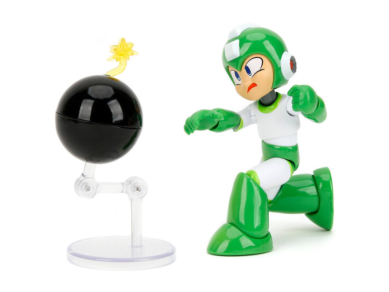 Left. Jada - Hyper Bomb 4.5" Moveable Figure with Accessories and Alternate Head and Hands "Mega Man" (1987) Video Game Model by Jada - Green with White.