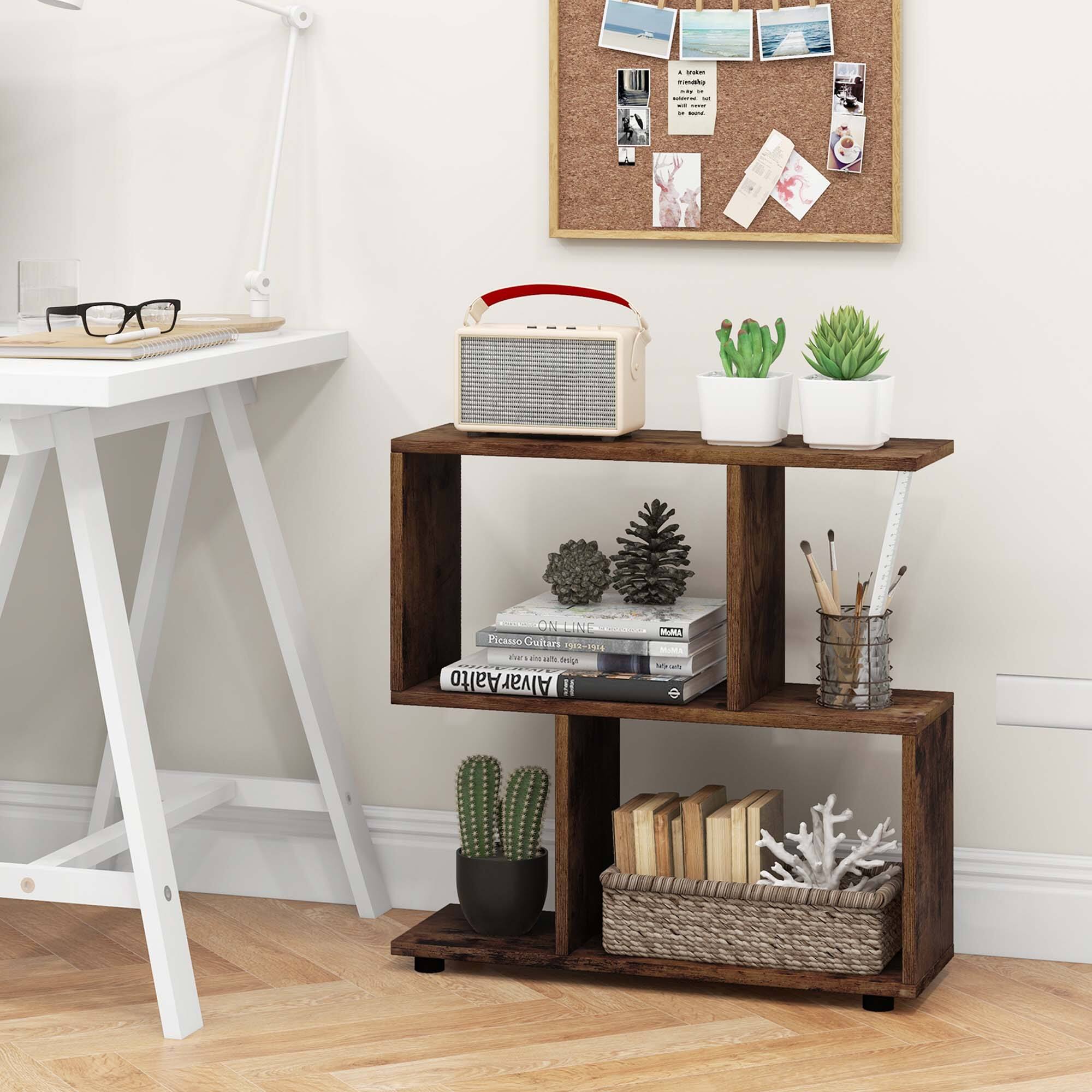 The image features a wooden shelf with various items on it, including a radio, a cactus, and a potted plant. There are also books and a pair of glasses placed on the shelf. The shelf is located next to a desk, and a corkboard is mounted on the wall above it. The scene appears to be a well-organized and functional space for work or leisure activities.