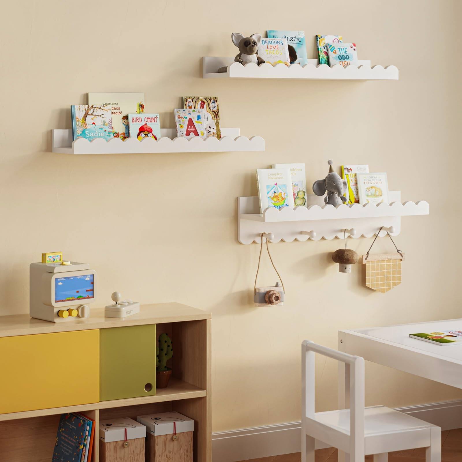 Sure, here is the corrected and grouped text from the image:

1. **Top Shelf:**
   - "DRAGONS LOVE TACOS"
   - "THE ODD EISU"

2. **Middle Shelf:**
   - "BIRD COUNT"
   - "Sadie"

3. **Bottom Shelf:**
   - "The Little Book of Thank You"
   - "The Little Book of Please"

4. **Additional Text:**
   - "Preathe"
   - "tam!"
   - "1N"