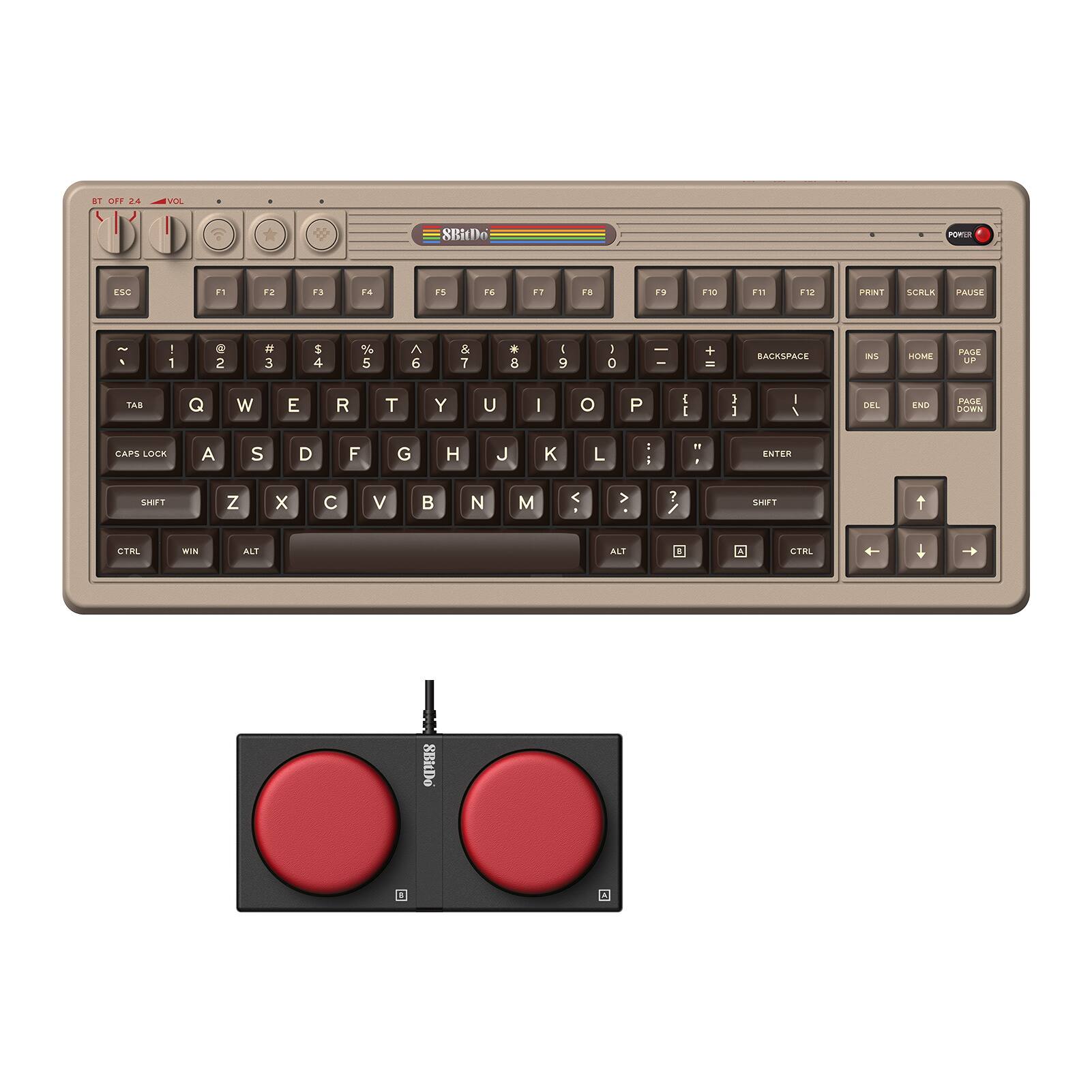 The image shows a close-up of a computer keyboard with a mouse on the right side. The keyboard has a distinctive design, featuring a rainbow strip across the top. The keys are arranged in a standard layout, with letters and numbers occupying the majority of the space. The mouse is positioned slightly above the keyboard, indicating that it is ready for use. The overall scene suggests a computer setup, possibly for a Macintosh computer, given the rainbow strip on the keyboard.