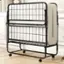 The image shows a metal bed frame with a white mattress on top. The bed frame is black and has a metal headboard. The mattress is placed on top of the bed frame, and it is white. The bed frame is designed to be sturdy and functional, providing support for the mattress and the person sleeping on it. The metal headboard adds an additional element of style and comfort to the bed.