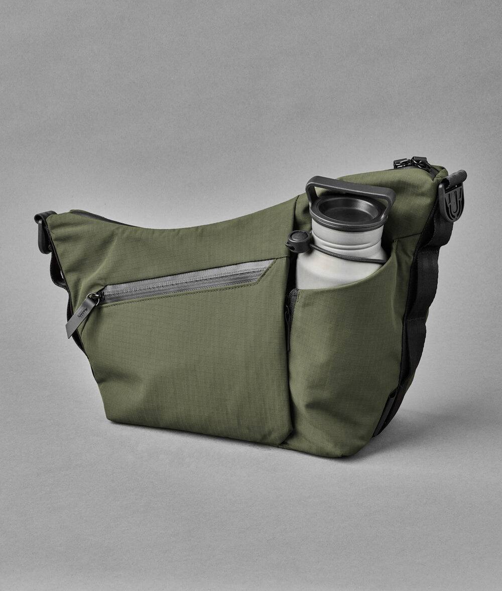 Alt View 1. ALPAKA - Flow Satchel 4L Crossbody Bag, Water Resistant Shoulder Bag, Expandable Bottle Pocket, YKK Zippers - Green Axoflux 210D.