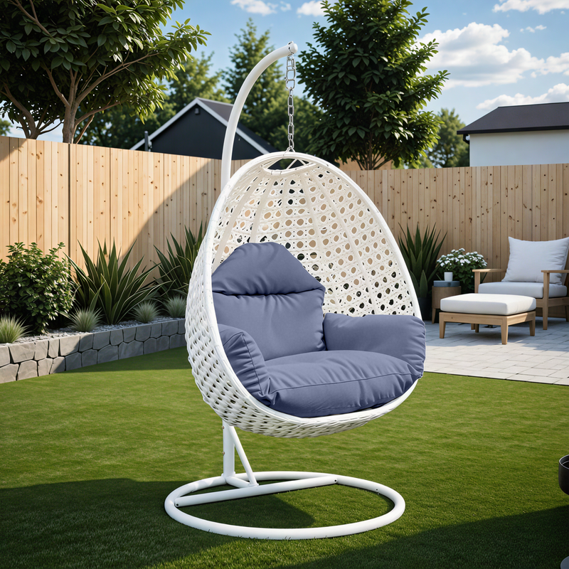 Angle. LeisureMod - LeisureMod Modern Handwoven White Wicker Egg Swing Chair with Stand - Single Hanging Indoor/Outdoor Chair for Patio - Charcoal Blue.