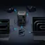 The image features a variety of electronic devices, including a laptop, a cell phone, and a camera. The laptop is placed on the left side of the image, while the cell phone is positioned in the middle. The camera is located on the right side of the image. The devices are all connected to a charger, which is placed in the center of the image. The arrangement of the devices and the charger suggests that they are being charged or synced together.
