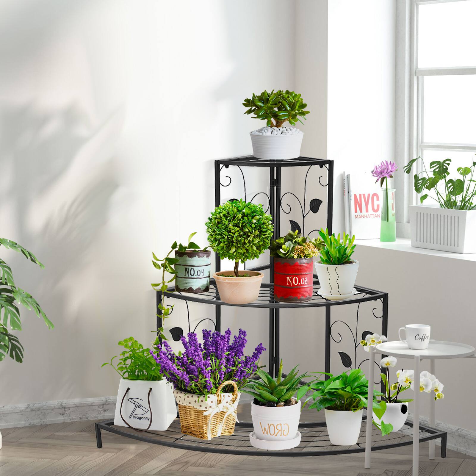 The image features a black metal plant stand with several potted plants on it. The plants are arranged in a tiered structure, with some plants placed on the top shelf and others on the lower shelves. The stand is located near a window, providing natural light for the plants.

There are a total of nine potted plants in the image, with various sizes and shapes. Some of the plants are placed closer to the window, while others are positioned further away. The plants are arranged in a visually appealing manner, creating an attractive display for anyone who enters the room.