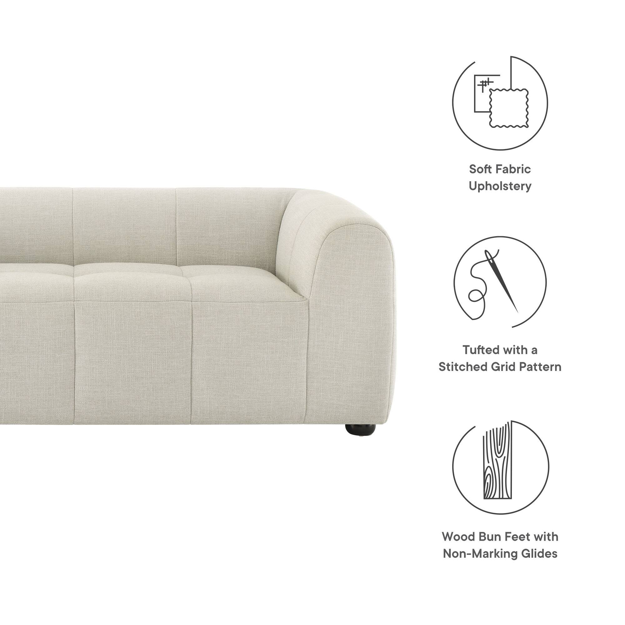 Soft Fabric Upholstery  
Tufted with a Stitched Grid Pattern  
Wood Bun Feet with Non-Marking Glides