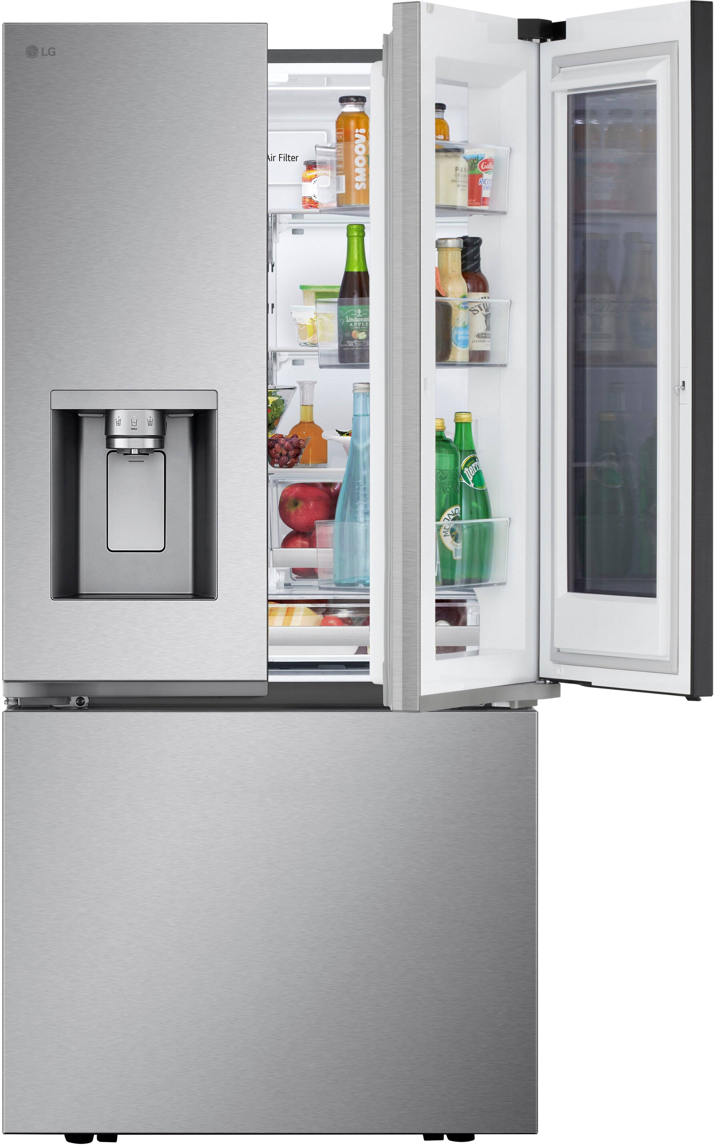 LG refrigerator with a water dispenser and ice dispenser. The fridge is filled with food and drinks, including bottles of water, juice, and milk. The refrigerator has a large freezer section and a water dispenser on the door.