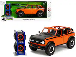 2021 Ford Bronco Open-Top Orange with Black Stripes & Hood w/Extra Wheels "Just Trucks" Series 1/24 Model Car by Jada - Multicolor