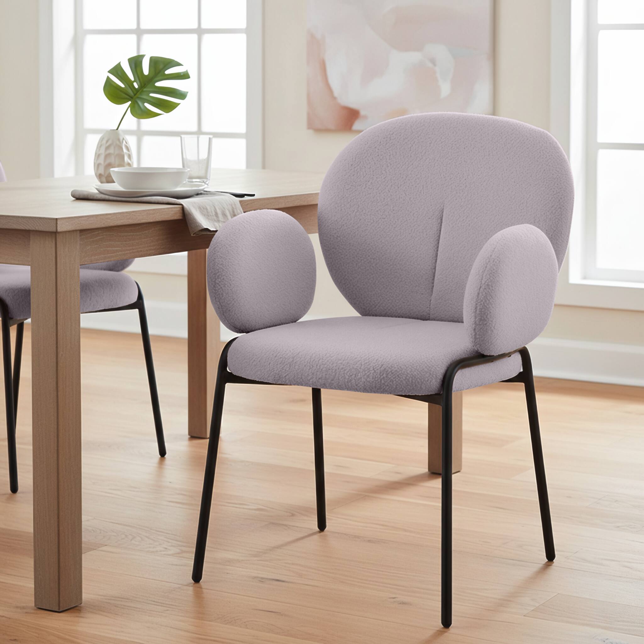 Left. LeisureMod - Celestial Modern Boucle Dining Chair with Arms, Textured Fabric Upholstered Armchair - Black Metal Frame Kitchen Chair - Grey.