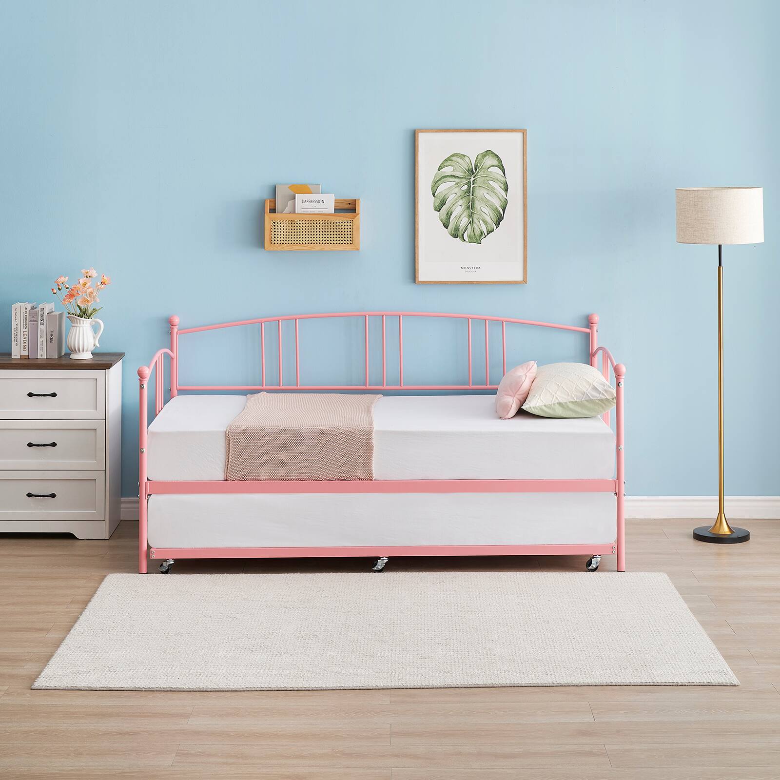 Left. Homhougo - Twin Rectangular Twin Metal Daybed with Trundle, Sofa Bed Frame with 6 Casters and Steel Slat Support - Pink.